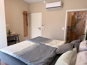 a bedroom with a bed and a window and a door at Privatroom for rent in Bad Fischau