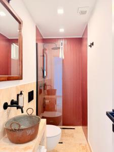 a bathroom with a sink and a toilet at Putechella Slow Living Retrait in Tramonti +49 photos