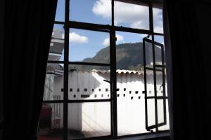 an open window with a view of a mountain view at Casa Samor in Bogotá