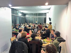 a group of people sitting at tables eating food at Sa Pa Camellia Hotel in Sapa +47 photos