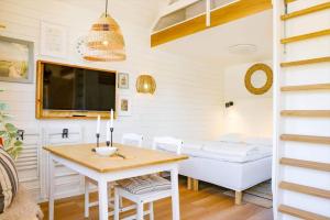 a small room with a table and a bed at 13503-Vig-Lyngvej-107-4 in Vig +7 photos