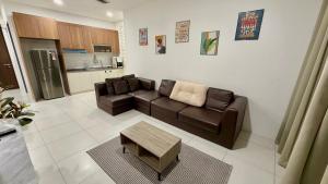 a living room with a couch and a table at The Podium, Kuching in Kuching