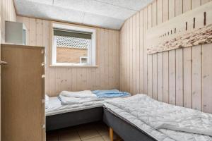a bedroom with two beds and a window at 2002-Romo-Juvrevej-51b in Høm +33 photos