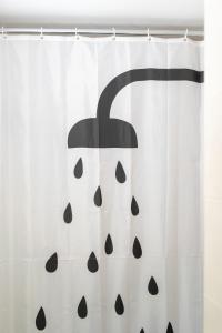a shower curtain with a black and white pumpkin at Rodostagma 2 in Rodholívos +23 photos