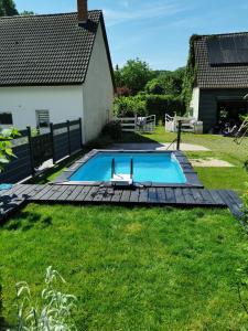 a swimming pool in the yard of a house at Alva in Sondershausen