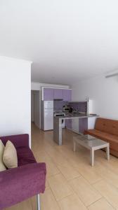 a living room with a couch and a table at Aydos Hotels & Breeze Restaurant in Dalyan