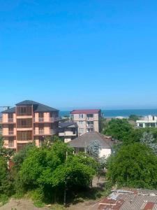a view of a city with buildings and the ocean at Memed abashidzis 16 in Kobuleti
