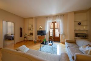 a living room with a couch and a table at Casa Olimpo in Agerola