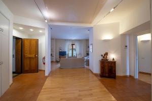 a hallway with a room with a couch and a table at Casa Olimpo in Agerola
