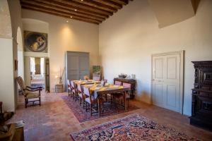 a large dining room with a table and chairs at Chateau de Durtal in Durtal