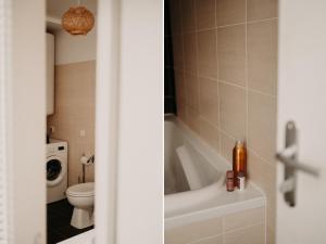 a bathroom with a toilet and a bath tub at Le Classique in Saint-Sulpice-le-Guérétois