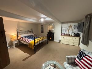 a bedroom with a bed and a fireplace in it at Oaklea House in Stoke on Trent