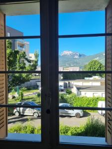 a view from the window of a parking lot at Chambre proche du Polygone scientifique - EdF - Schneider - GEM in Saint-Martin-le-Vinoux