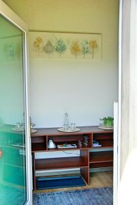 a bathroom with a sink and a counter at La Boutique in Saignelégier