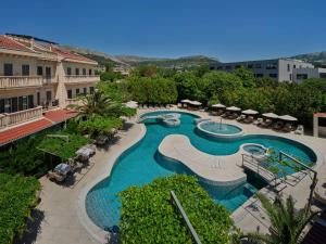 an overhead view of a swimming pool in a resort at Hotel President Solin in Solin