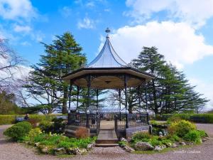 a gazebo in the middle of a park at Rosemount Guest Suite in Grange Over Sands