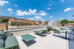 a view from the roof of a building with chairs and tables at Hotel Raffaello - Sure Hotel Collection by Best Western in Rome