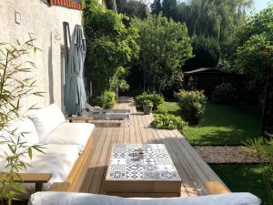a patio with a couch and a coffee table at Home Sweet Home in Loos