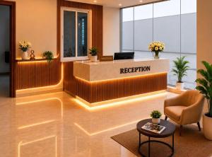 a reception area of a hotel lobby with a reception desk at SUITE ROOMS Sarjapur Road Near to HSR Layout in Bangalore