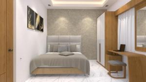a bedroom with a bed and a desk at SUITE ROOMS Sarjapur Road Near to HSR Layout in Bangalore