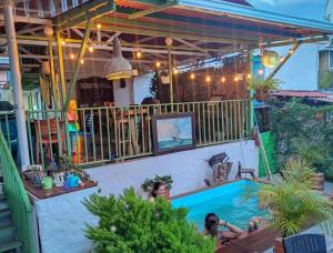 a house with a swimming pool in the backyard at Hostal Vistaguila in Salento +16 photos
