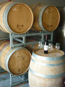 a group of wine barrels with wine glasses at Weingut Bernhard in Daisendorf +12 photos