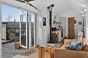 a living room with a couch and a fireplace at 1 Bed in Belford oc-cn002 in Lucker +9 photos
