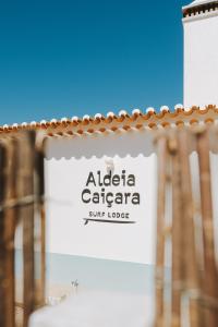 a sign for a alica calaza super lodge at Aldeia Caiçara Surf Lodge - Arrifana in Aljezur