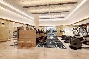 a gym with a lot of treadmills and machines at InterContinental Jerusalem by IHG in Jerusalem
