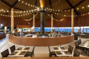 a restaurant with tables and chairs and lights at Holiday Inn Club Vacations Royal Haciendas All Inclusive in Playa del Carmen