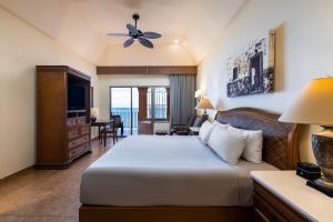 a hotel room with a bed and a television at Holiday Inn Club Vacations Royal Haciendas All Inclusive in Playa del Carmen