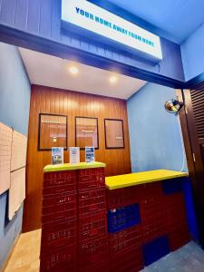 a room with a counter with red shopping carts at HHHH Hostel in Banyuwangi +52 photos