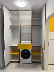 a laundry room with a washer and dryer at Studio Militari Residence - MR1 in Chiajna