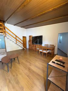 a living room with a table and a dining room at Villa CarlaSophia in Calasparra