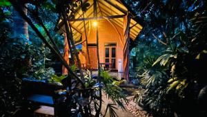 a small building with a light on the front at Ama Eco Lodge in Sigiriya +13 photos
