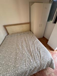 a bedroom with a bed with a comforter on it at Villa CarlaSophia in Calasparra +10 photos