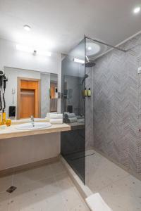 a bathroom with a sink and a shower at SOL by Meliá Nessebar Bay All Inclusive in Nesebar +91 photos