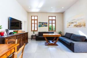 a living room with a couch and a table at Rethymno Youth Hostel in Rethymno