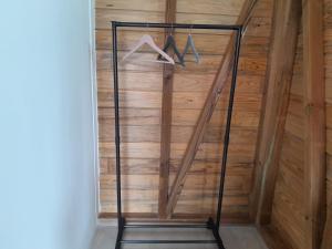 a room with a wooden wall with a closet at Studio LAVANDES in Lamentin