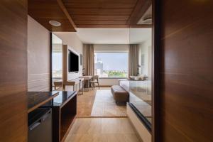 a room with a view of a living room at Temple Tree Hotel Shirdi, a member of Radisson Individuals in Shirdi