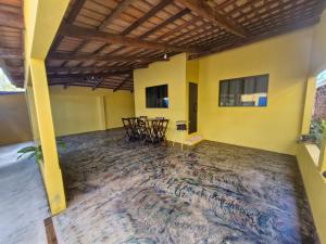 a room with chairs and a table in a building at Casa da Nair in Sao Jorge