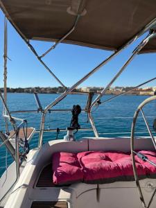 a boat with a red pillow on the back of it at Echappée belle in Cros-de-Cagnes