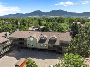 an aerial view of a building with mountains in the background at Flatirons Hideaway in Boulder CO in Boulder