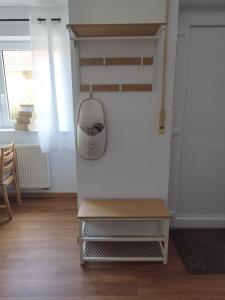 a room with a table and a mirror on the wall at Gästezimmer mit eigenem Eingang in Schwäbisch Hall