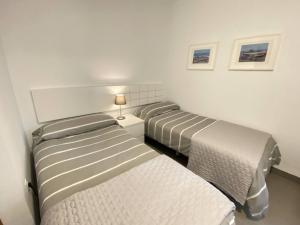a room with two beds in a room at Villa Majada Del Aceitun in Gran Tarajal +35 photos