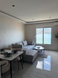 a living room with a couch and tables at Bellanti2 in Igalo