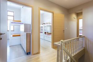 a room with a hallway with a staircase and a mirror at Rethymno Youth Hostel in Rethymno +9 photos