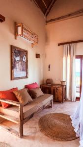 a living room with a couch and a window at Villa Upendo with Private Pool and Ocean View Zanzibar in Pingwe +77 photos