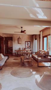 a living room with a couch and a table at Villa Upendo with Private Pool and Ocean View Zanzibar in Pingwe