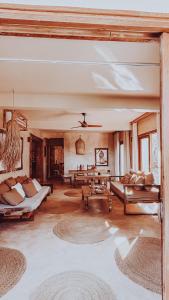 a large living room with couches and a table at Villa Upendo with Private Pool and Ocean View Zanzibar in Pingwe